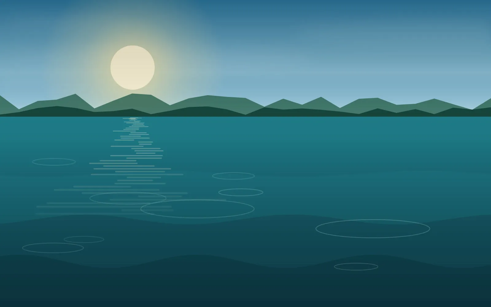 Clear blue lake water with rings spreading across a light surface ripple